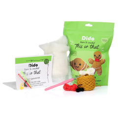 Crochet kit with yarn, hooks, and packaging on a white background